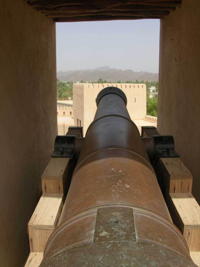 Muscat 06 Nizwa 08 Round Tower Cannon The Round Tower was designed for the new era of the cannon, with gun ports commanding a 360-degree field of fire. There are 24 openings all around the top of the tower for mortar fire.